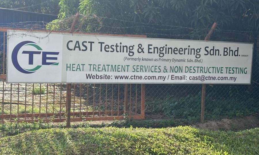 CAST Testing & Engineering Sdn Bhd signboard at the company's facility: heat treatment services and non-destructive testing